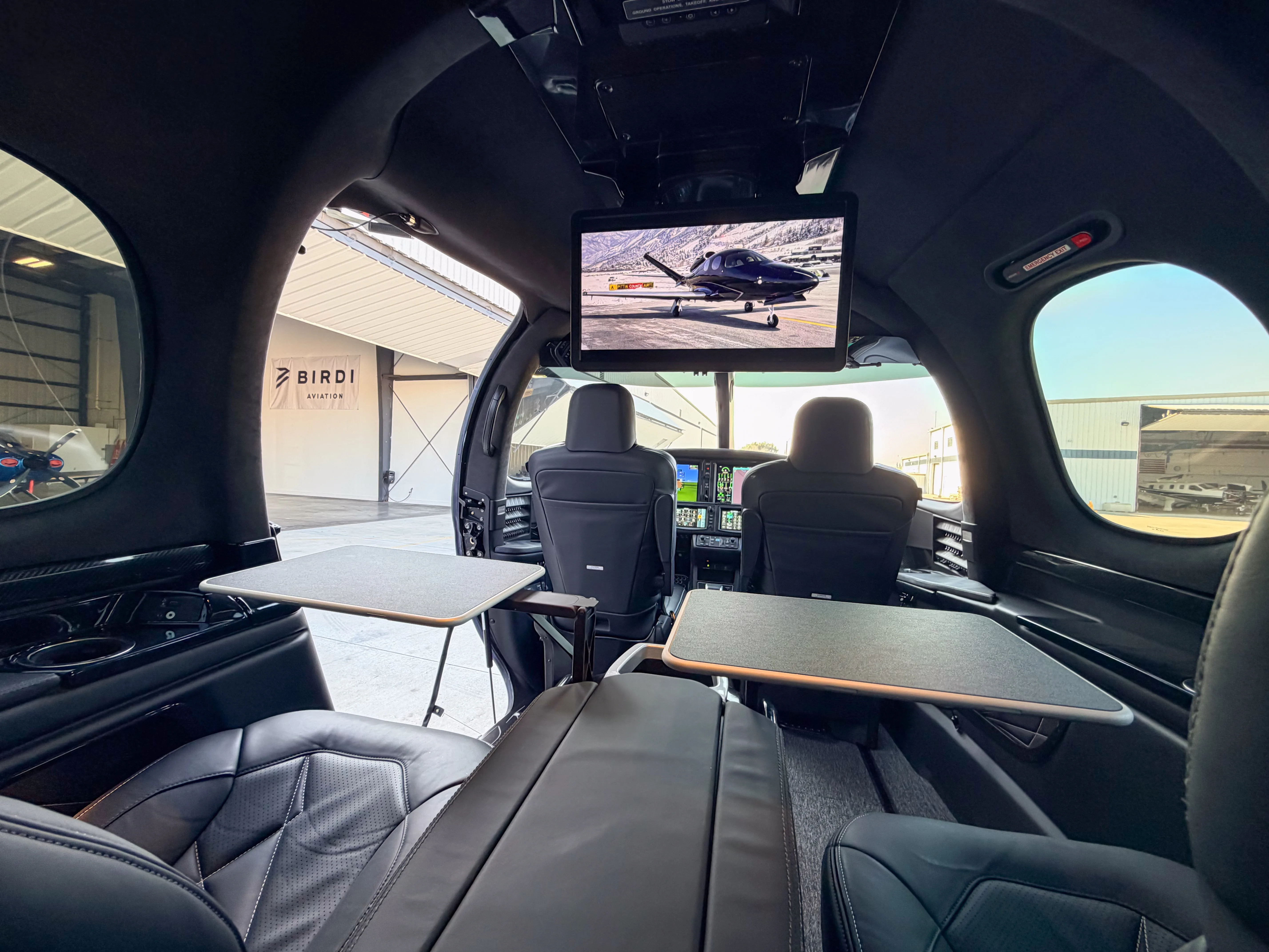 Private Vision Jet cabin with club seating and work tables